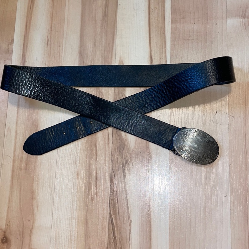 Old navy leather belt with pretty embossed buckle